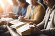 © Adobe Contributor - A group of people reading the Bible