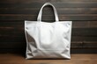 White tote bag mockup on wooden background