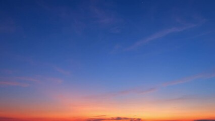 Wall Mural - The sunrise sky transforms rapidly, clouds dancing in a time-lapse spectacle. A burst of colors emerges, painting the canvas of dawn. Nature concept. Timelapse.
