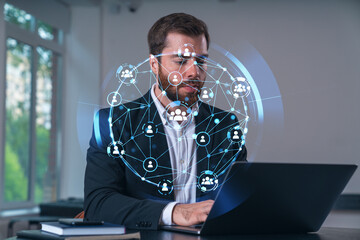 Wall Mural - smiling businessman in formal wear working on laptop at office workplace with smartphone and noteboo