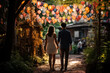 a couple walks trough a flower garden with pink lanterns hanging valentine concept