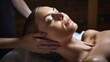  a woman getting a back massage with her hands on the back of the woman's head in a spa room.