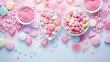  a couple of bowls filled with hearts next to a bowl of pink and blue sprinkles on a blue surface.