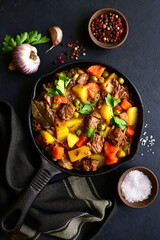 Wall Mural - Meat stew with vegetables. Top view with copy space.