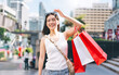 © dodotone - Walking asian woman travel and shopping in city lifestyles at outdoors on day