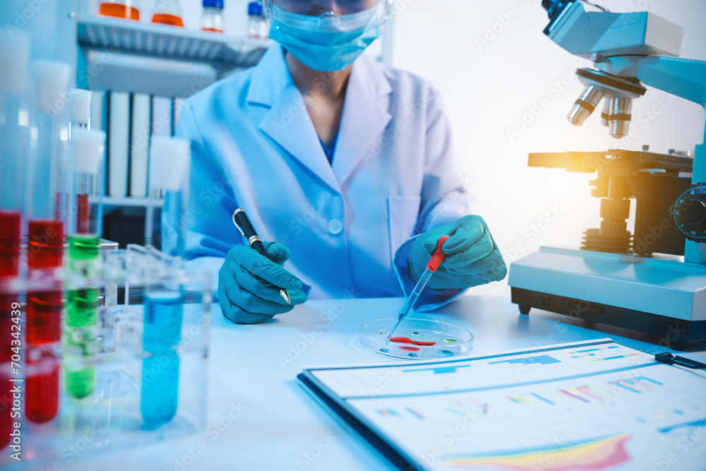 Asian people scientist in lab coat and protective gloves working with ...