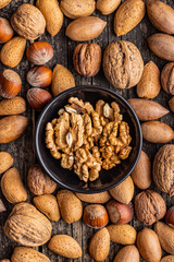 Wall Mural - Peeled dried walnut kernels in bowl. Top view.