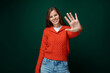 © Ivan Traimak - Portrait of a bright positive young woman in a red sweater on a dark green background