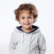 © vadosloginov - Stock image of a child in casual clothing on a white background Generative AI