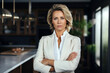 © Veronika - businesswoman standing in the kitchen