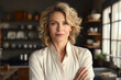 © Veronika - businesswoman standing in the kitchen