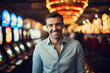© Bougie Banana - Happy man at casino slot machines enjoying nightlife lifestyle
