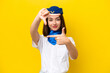 Airplane stewardess Ukrainian woman isolated on yellow background focusing face. Framing symbol