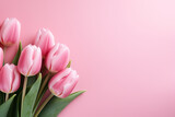 Fototapeta Tulipany - pink tulips on a pink background, top view with space for text, banner or screensaver