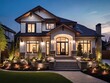 Beautiful home exterior in the evening with glowing interior lights and landscaping