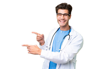 Wall Mural - Young doctor man over isolated background pointing finger to the side and presenting a product