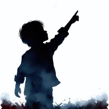 Silhouette Of A Young Boy Pointing Toward The Sky.