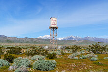 Desert Hot Springs, California Water Tower Centered In Frame With Snow Capped San Gorgonio Mountains In The Background