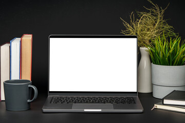 Canvas Print - Laptop with blank screen on table against black background