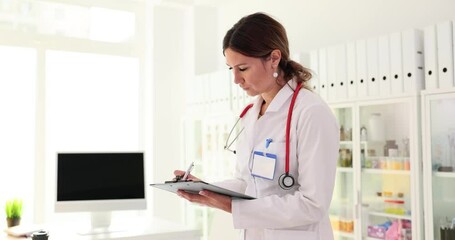 Wall Mural - Doctor stands with medication history records in clinic