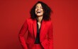 Laughing woman in red suit
