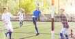 © JackF - Young football players fighting for ball in goalmouth zone