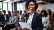© Krtola  - African young business woman in front of a group