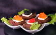  Black red caviar on sandwiches, decorated with greenery. Restaurant food breakfast dinner lunch
