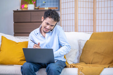 Wall Mural - Busy male professional businessman entrepreneur person sitting talking communication phone with working desk laptop notebook technology communication indoor home workplace, adult business man manager