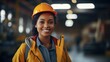 portrait of a young african american woman wearing a hardhat in a factory
