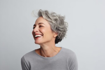 Wall Mural - Portrait of a happy middle-aged woman with grey hair.