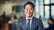 © tong2530 - Asian mature professional business man standing in an office smiling confidently. Business corporate people background.
