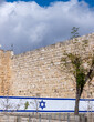 Large Israeli flag on Jerusalem's Old City Wall background