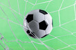 © xy - Soccer ball goal success on green background