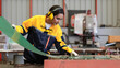 © Nassorn - Latin engineer in safety uniform work in heavy steel engineering factory. Young female hispanic worker wear protective gear checking production machinery equipment in metalwork manufacturing facility