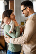 © NDABCREATIVITY - Family, parenthood and people concept. Happy young mother, father with new born baby at home
