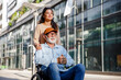© Westend61 - Smiling social worker behind senior man in wheelchair