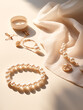 Jewelry lifestyle. Jewellery background. Table with beautiful and stylish golden and pearl necklaces, chains and elegant pendants. Fashion accessories.