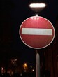 © mad_production - Close up of illuminated no entry road sign at night