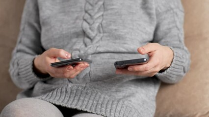 Woman hand using phone, indoors. Woman holding smartphone