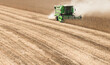 © Dusan Kostic - Harvesting of soybean field with combine.