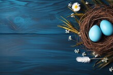 Banner. Easter Eggs, Feathers In A Nest On A Blue Wooden Background. The Minimal Concept. Top View. Card With A Copy Of The Place For The Text