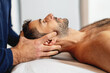 Gentle craniosacral therapy performed by an osteopath, targeting neck pain.