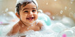 Indian Baby smile and bath in a bubble bath with soapy bubbles. Joyful bathing kid, daily routine, washing baby.