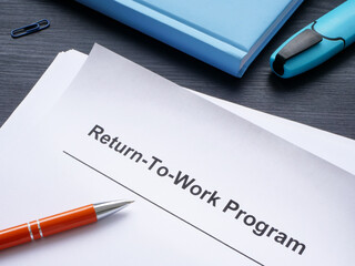 papers with return-to-work program and pen.
