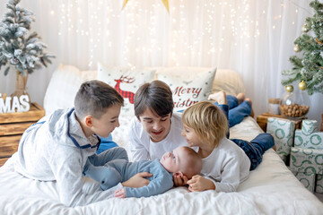 Sticker - Happy family, newborn baby and older brothers, mom at home on Christmas