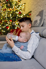 Poster - Happy family, newborn baby and older brothers, mom at home on Christmas