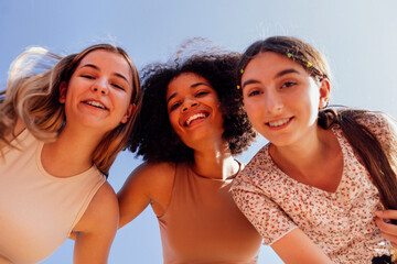 Wall Mural - Group of teenagers of different nationalities and appearance have a fun together.