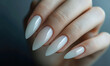 stiletto shaped manicured nails on dark background