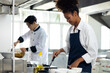 © NVB Stocker - portrait young teen girl cook student. Cooking class. culinary classroom. happy young african woman students holding fresh vegetables for cooking in cooking school.